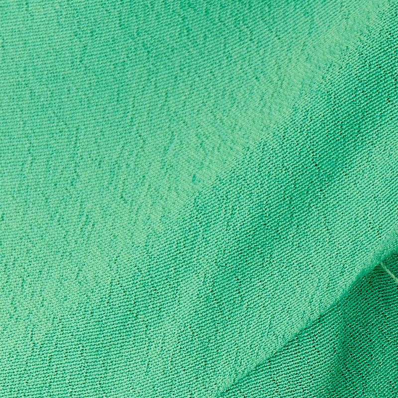 Textura-del-tejido-verde-de-la-blusa-cropped.