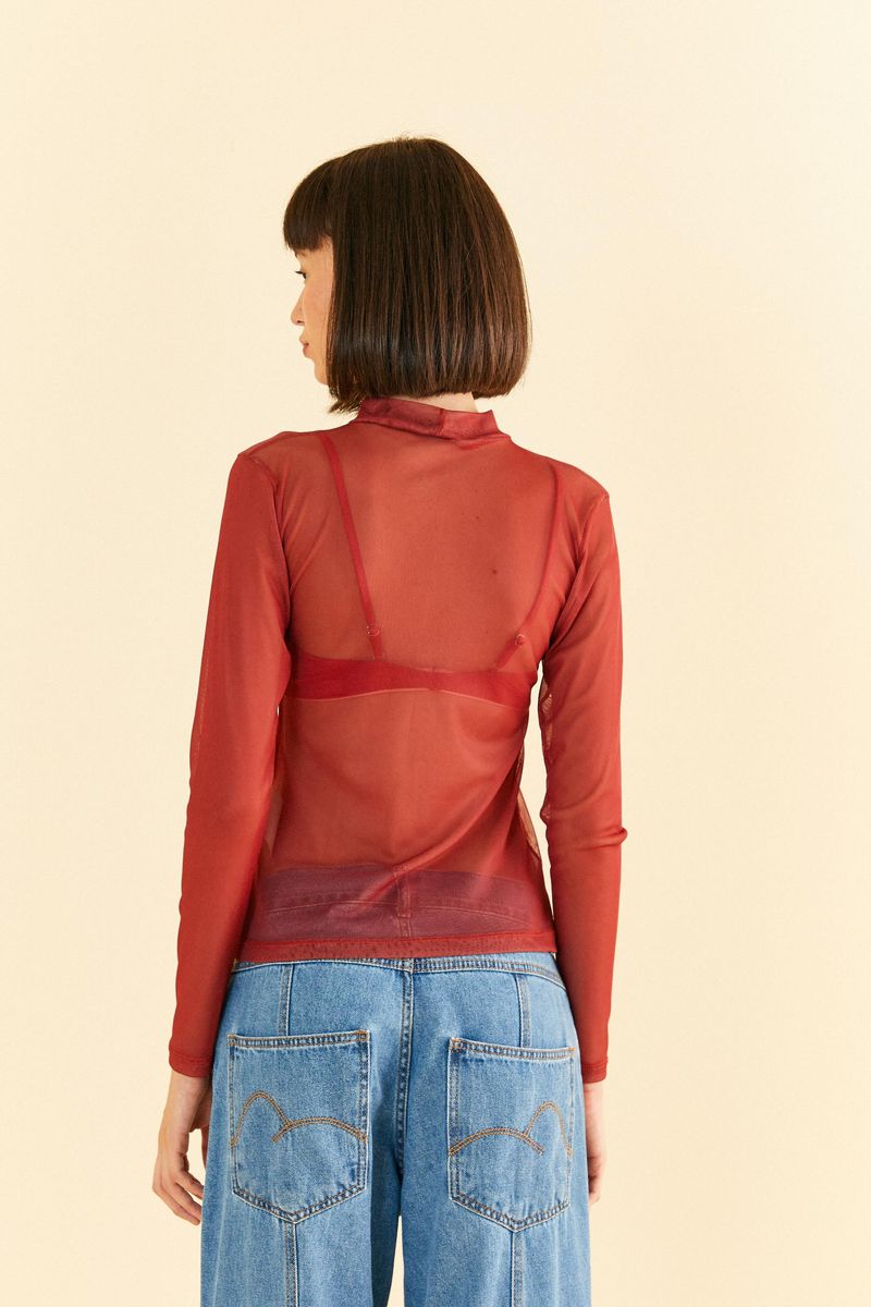 Vista-posterior-de-la-blusa-de-tul-verde-con-cuello-alto.