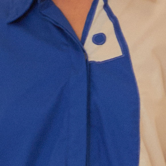 Primer-plano-del-detalle-del-boton-y-solapa-contrastante-de-la-Camisa-Cutwork-Pez.