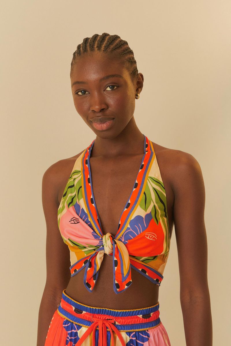 Top-halter-con-estampado-tropical-y-lazo-frontal.