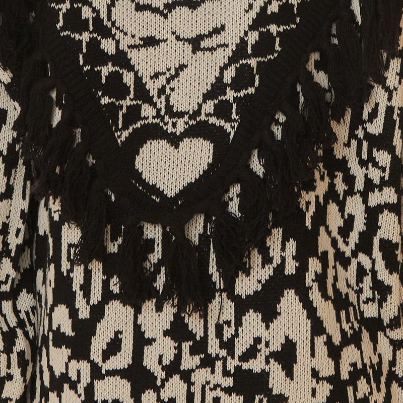 Vista-trasera-del-cardigan-tricot-Onza-PB-mostrando-el-diseño-geometrico-y-los-detalles-de-volantes.