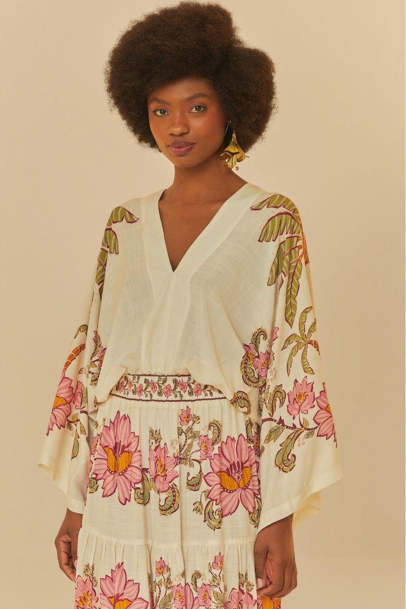Body Ravenala con escote en V profundo y estampado floral vibrante.