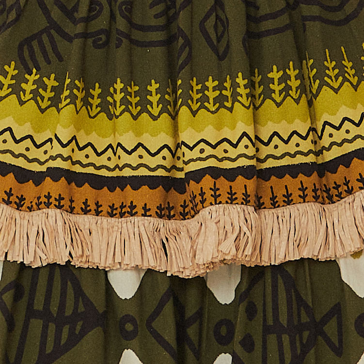 Vista-trasera-de-la-falda-con-volantes-y-flecos-estampado-tropical-en-tonos-de-verde-y-amarillo.