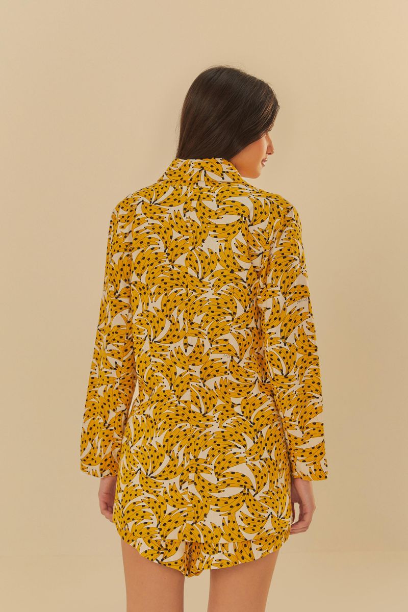 Blazer Nanica de la Farm con estampado tropical vibrante, visto de espaldas.