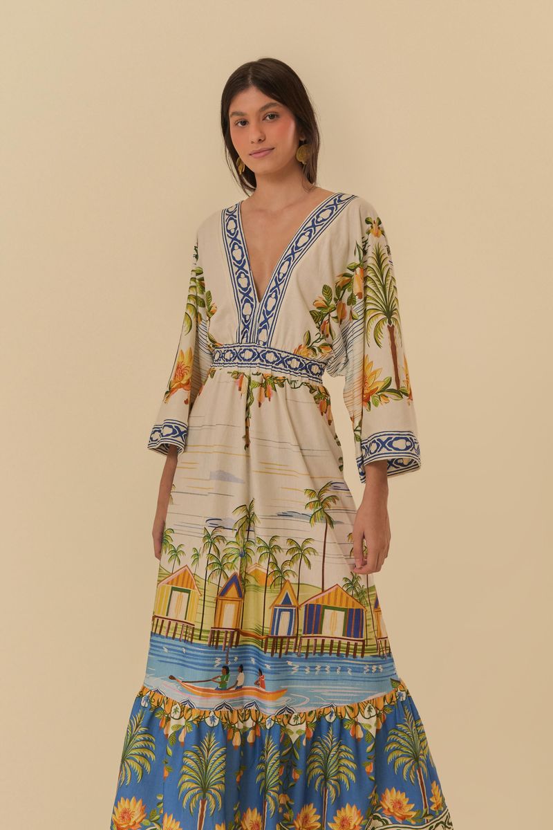 Vestido cropped con estampado tropical, escote en V profundo, mangas largas.