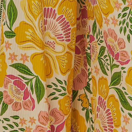 Vista-trasera-de-la-blusa-floral-con-volantes-y-diseño-asimetrico.