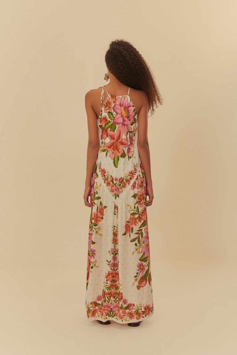 Vista trasera del vestido floral, mostrando el diseño de la espalda y el estampado.