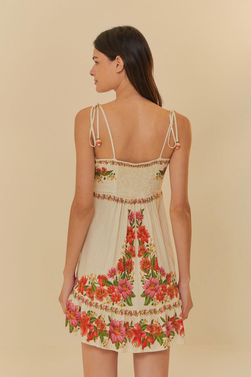 Vista trasera del vestido floral mostrando el diseño entallado.