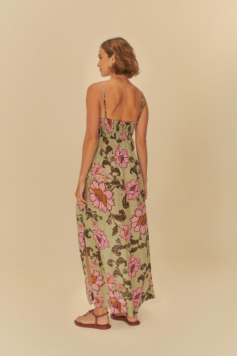 Imagen del detalle del corset de un vestido largo con estampado floral en tonos rosados y verdes.