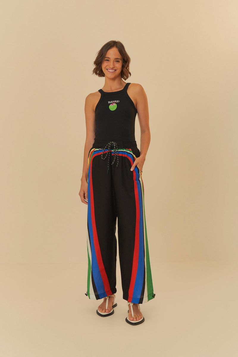 Pantalón negro con recortes coloridos y amarre en la cintura, vista trasera.