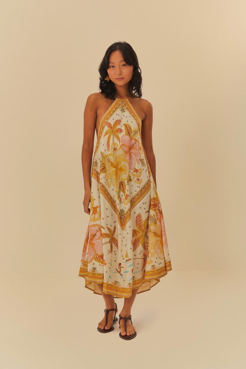Vestido cropped con estampado floral en tonos cálidos, vista trasera.