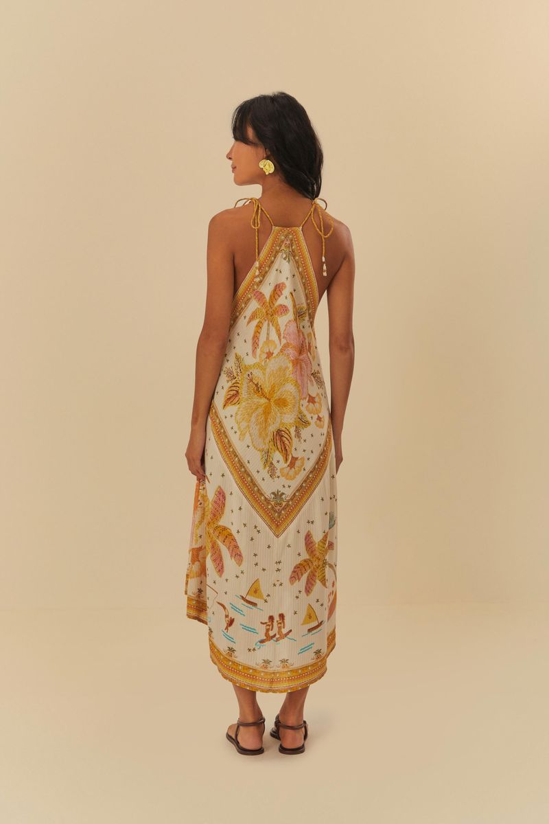 Vista lateral del vestido cropped con estampado floral, mostrando los tirantes.