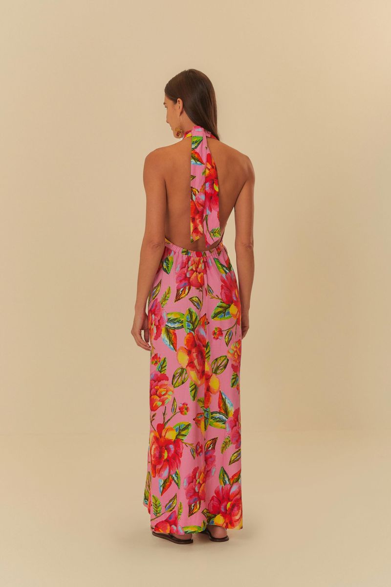 Vista-trasera-del-vestido-largo-estampado-con-flores-vibrantes-mostrando-el-diseño-abierto-en-la-espalda.