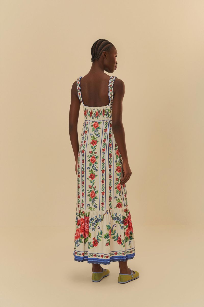 Vista posterior del vestido largo estampado con tirantes anchos y diseño floral.