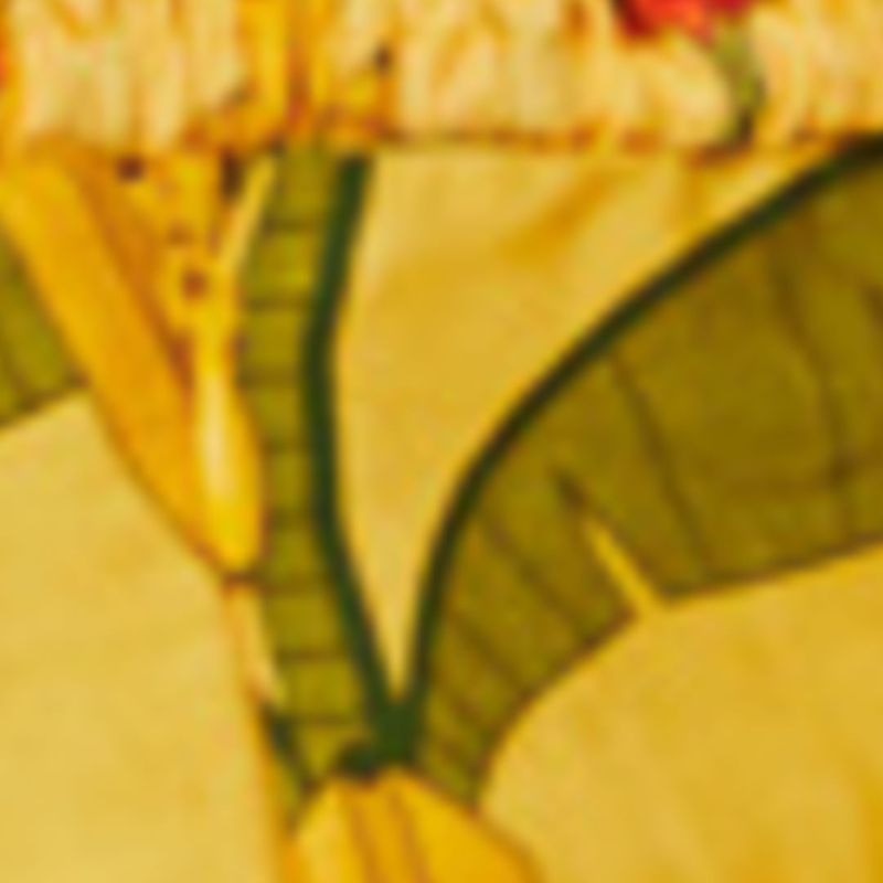 Close-up-del-estampado-de-bananas-en-fondo-amarillo-de-la-blusa.