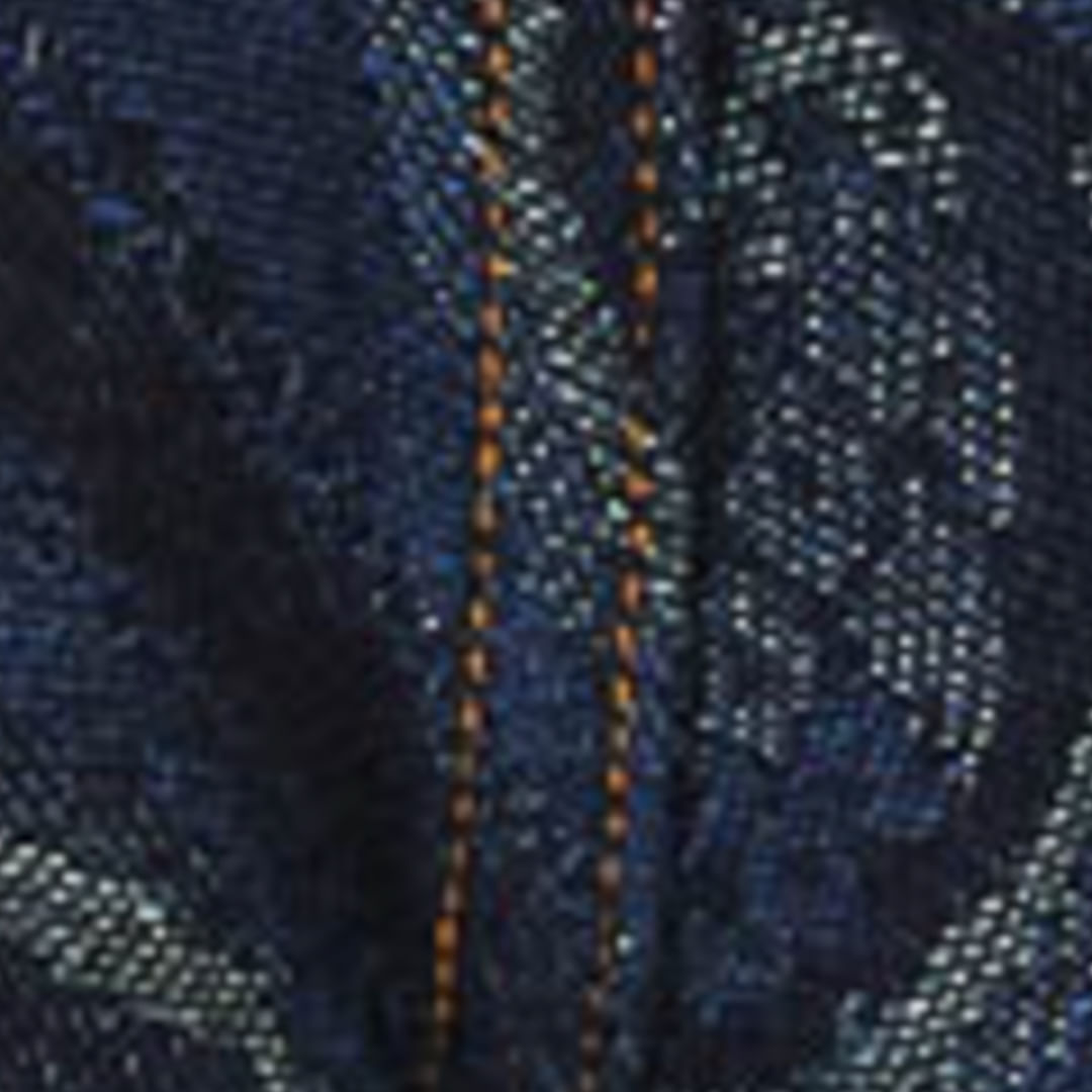 Detalle de tela jacquard jean con estampado de piña mostrando textura y acabado.