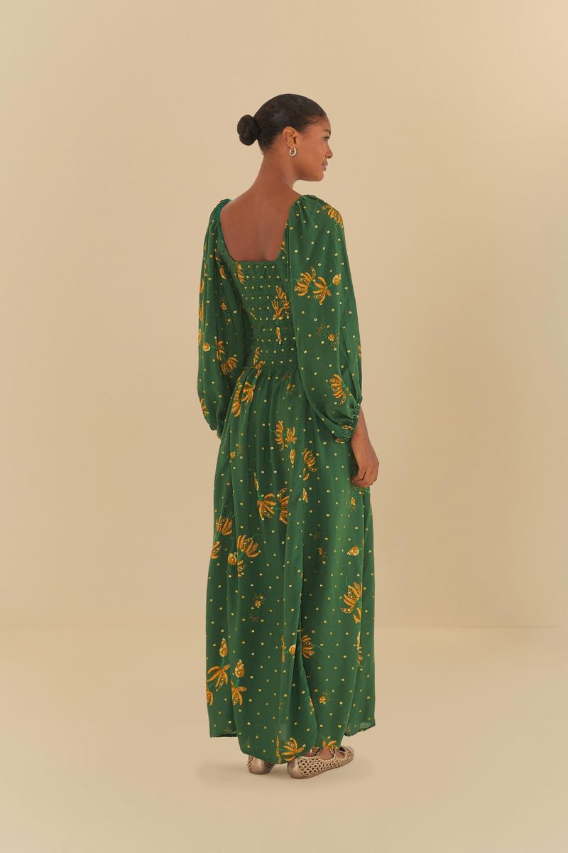 Vista-trasera-del-vestido-largo-verde-con-estampado-de-bananos-y-brillo.