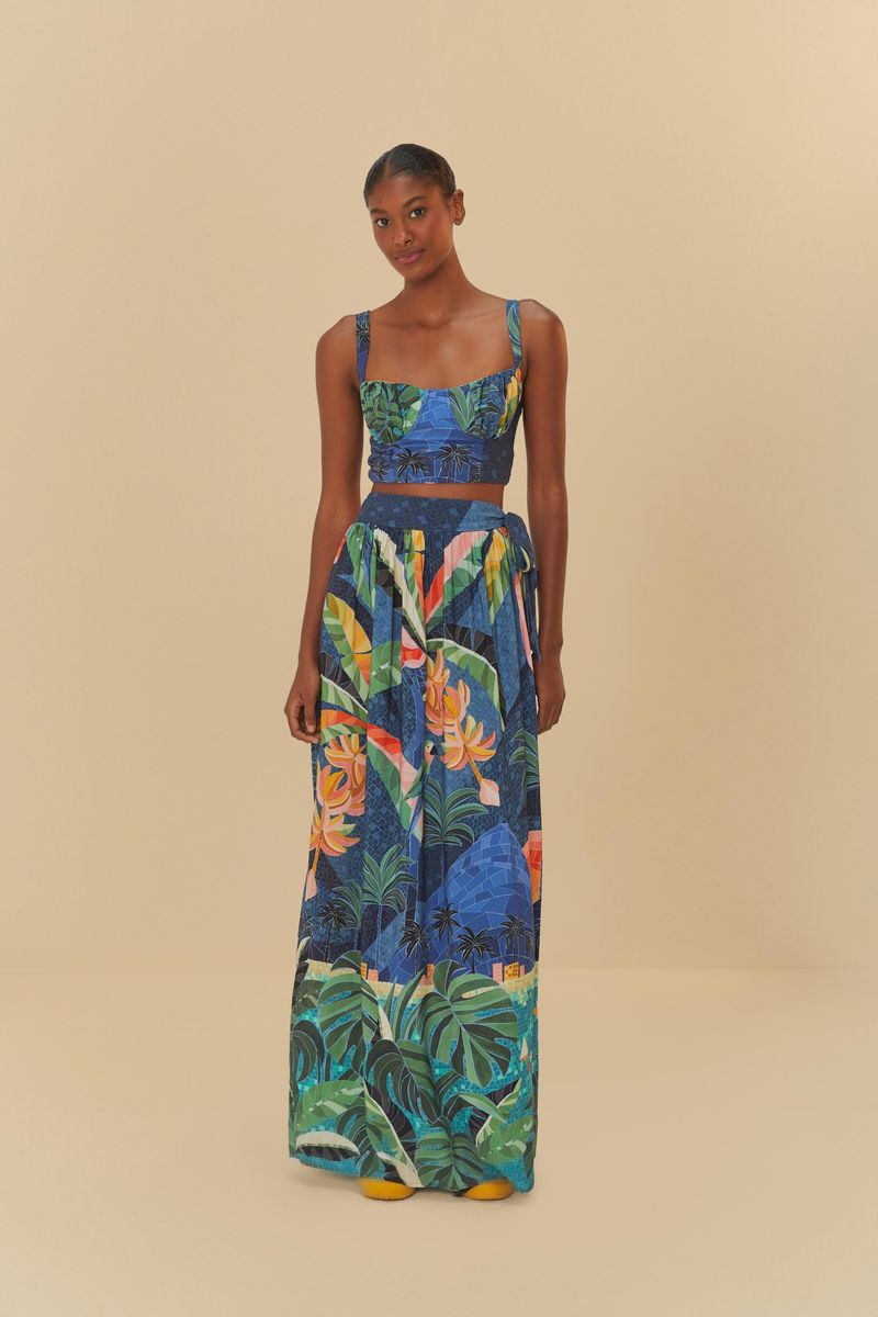 Vista frontal de la Calça Río De Mosaico con estampado tropical vibrante.