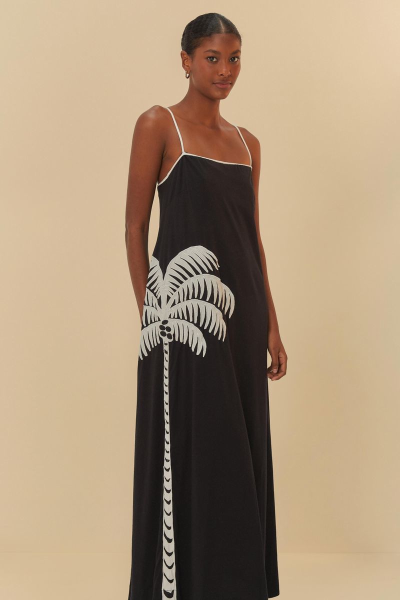 Vestido-cropped-negro-con-diseño-de-palmera-blanca-tiras-delgadas-y-falda-larga.