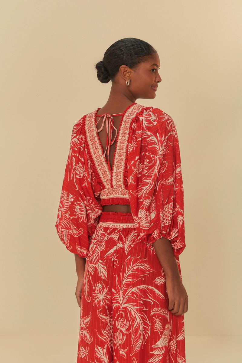 Blusa-Franzida-Amalfi-con-estampado-botanico-en-rojo-y-blanco-vista-trasera.