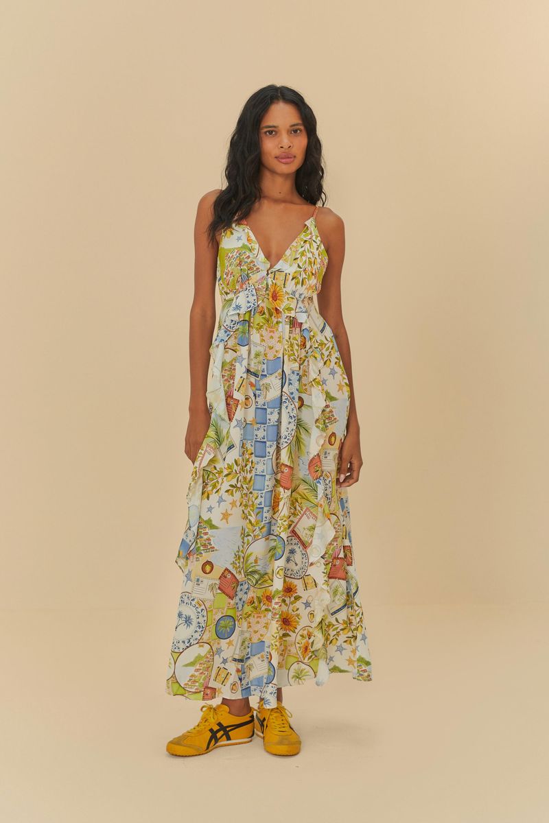 Imagen de un vestido largo estampado con tirantes finos y volantes, visto de frente.