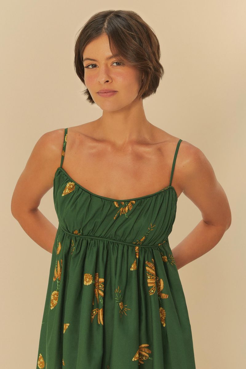 Vestido-largo-verde-con-estampado-de-bananos-amarillos-tirantes-delgados-y-escote-redondeado-detalle-del-corse-y-tirantes.