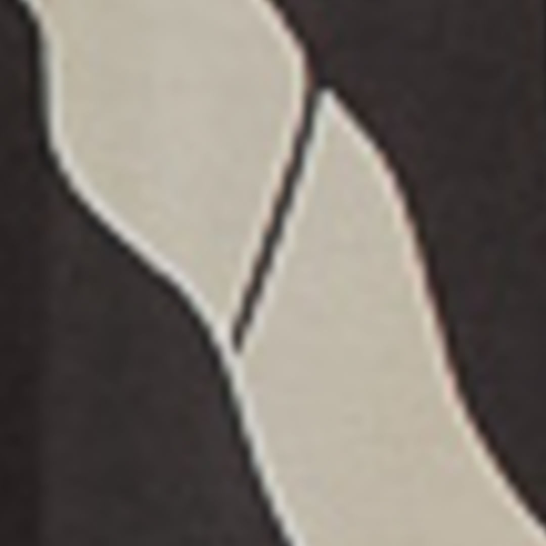 Close-up del diseño de panteras del Macaquito Panteras.