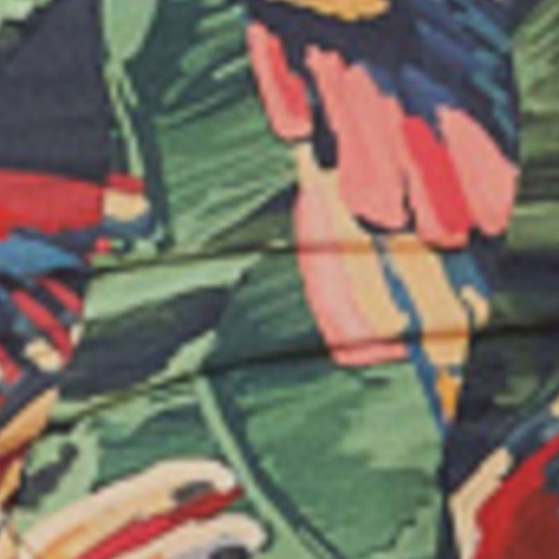 Detalle del estampado de la Blusa Vood Dos Pájaros con elementos tropicales en colores vibrantes.