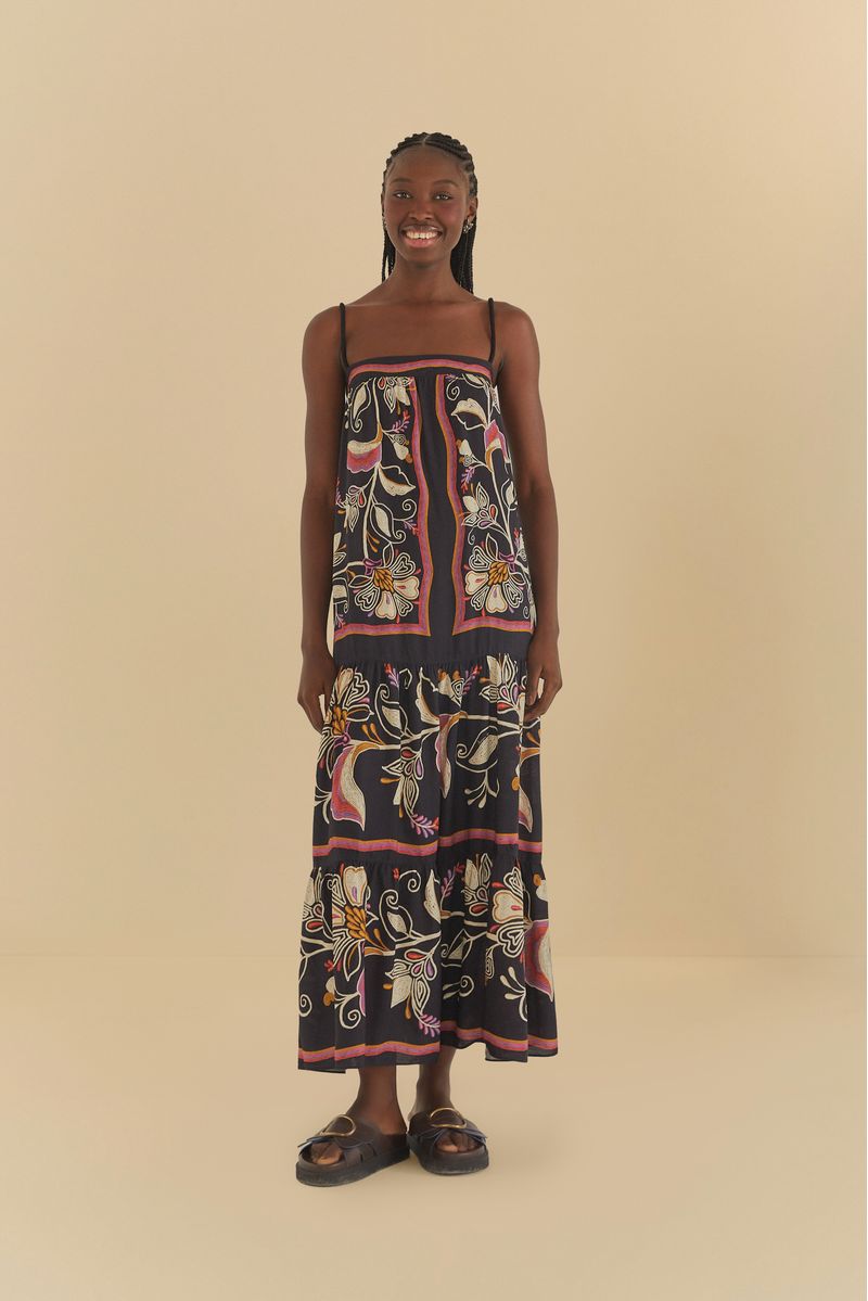 Imagen de un vestido cropped con estampado floral y tirantes delgados, visto de frente.