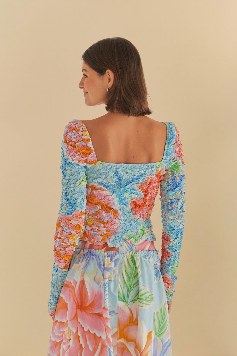 Vista trasera de la Blusa Lastex Mangas Floral Sofia destacando el ajuste.