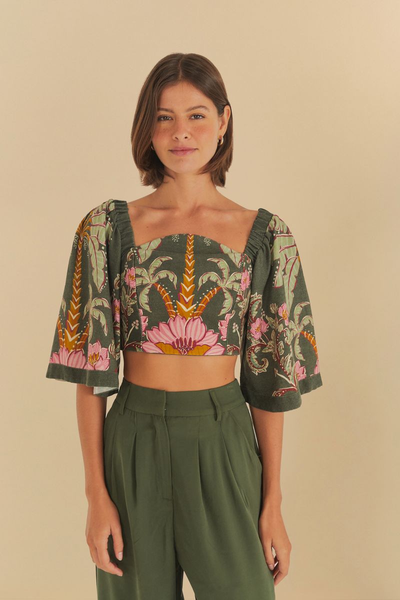Blusa Ravenala S con estampado tropical y mangas abullonadas, vista frontal.