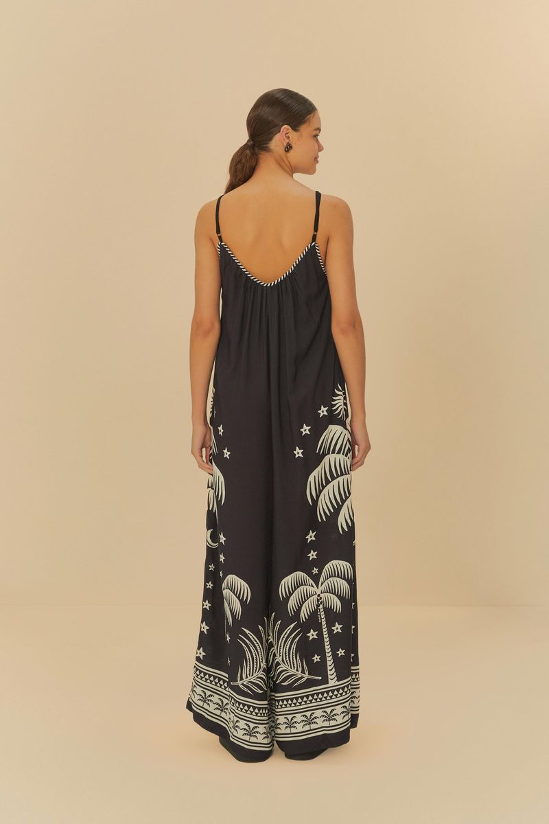 Vista trasera del Macacón Pantalona Coqueiral, destacando la caída suelta y estampado tropical.