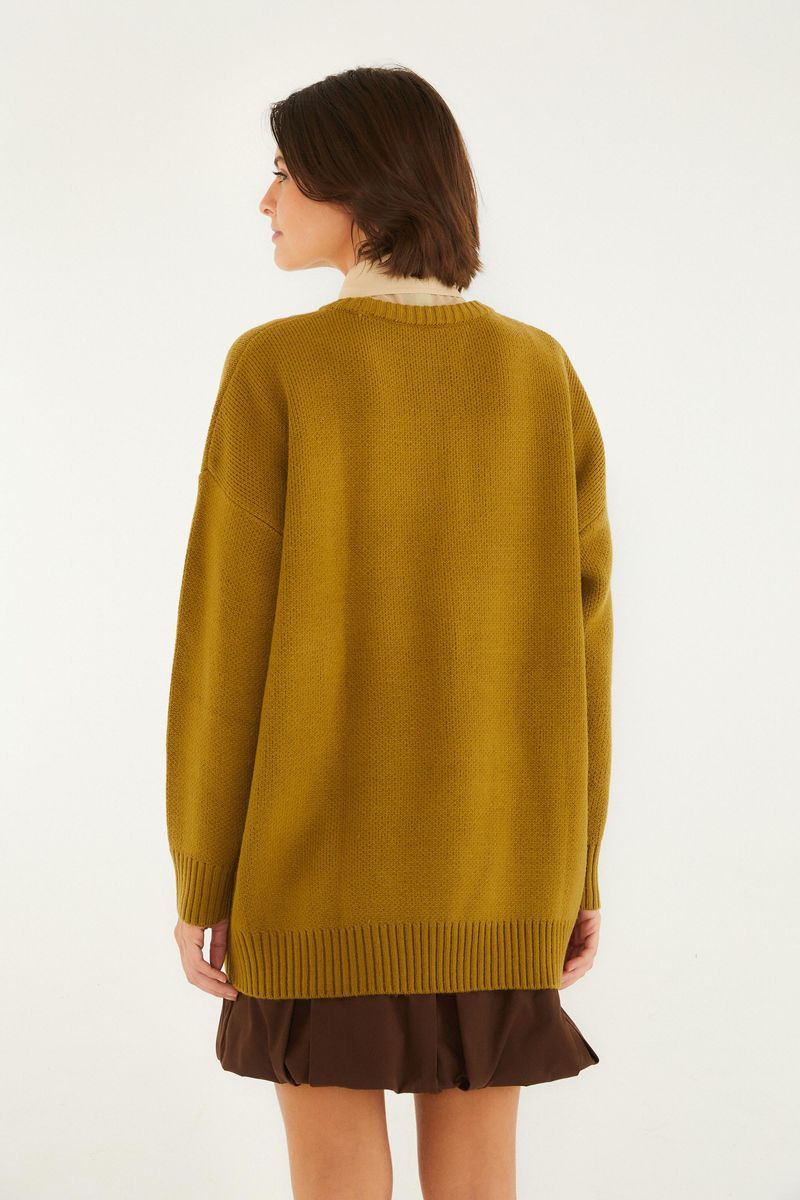 Vista trasera del cardigan de tricot Farm Rio, destacando la caída y estilo.