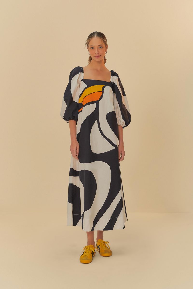 Vestido largo estampado con mangas abombadas y escote cuadrado, exhibido sobre un fondo neutro.