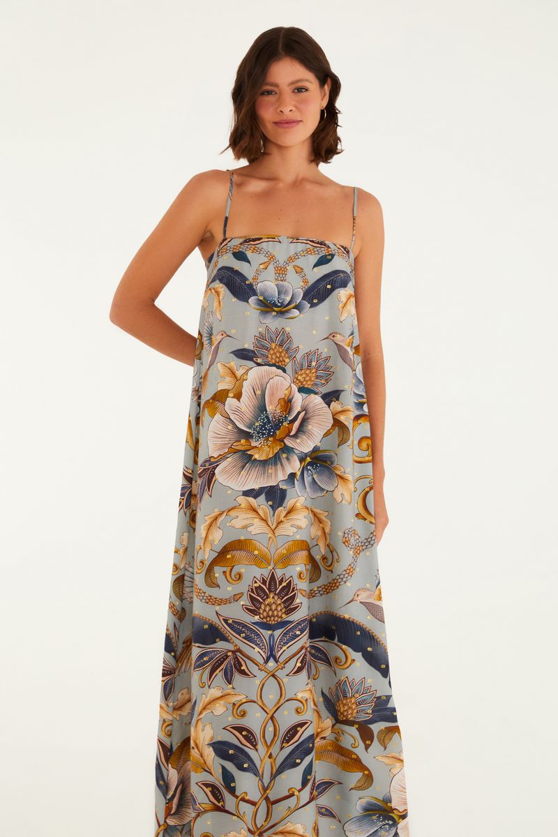 Imagen de un vestido cropped con estampado floral y botánico, mostrado de lado.