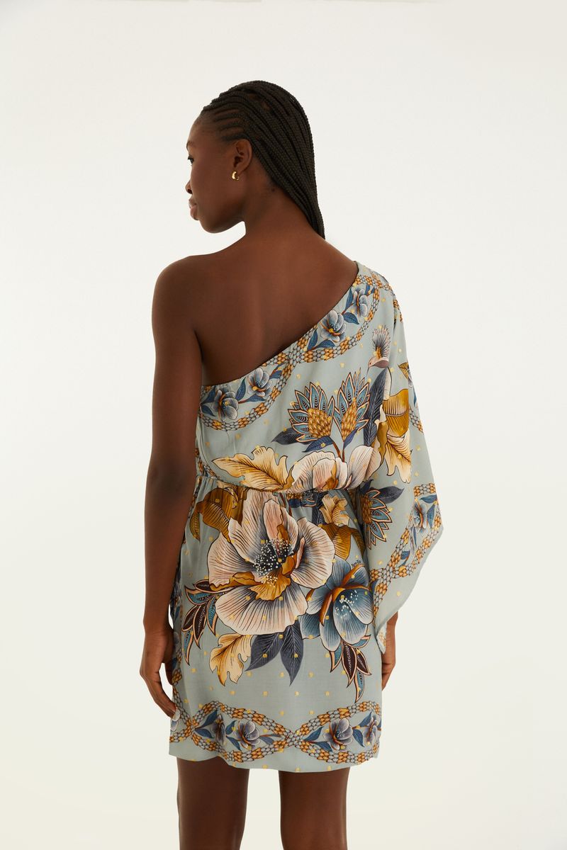 Vista trasera del vestido corto con estampado floral, destacando el diseño de un solo hombro y el ajuste en la cintura.