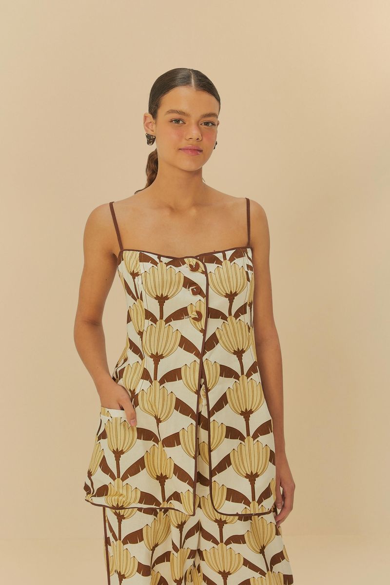 Vista frontal de la Túnica de Sastrería Banana Deco con estampado botánico de bananos sobre fondo beige.