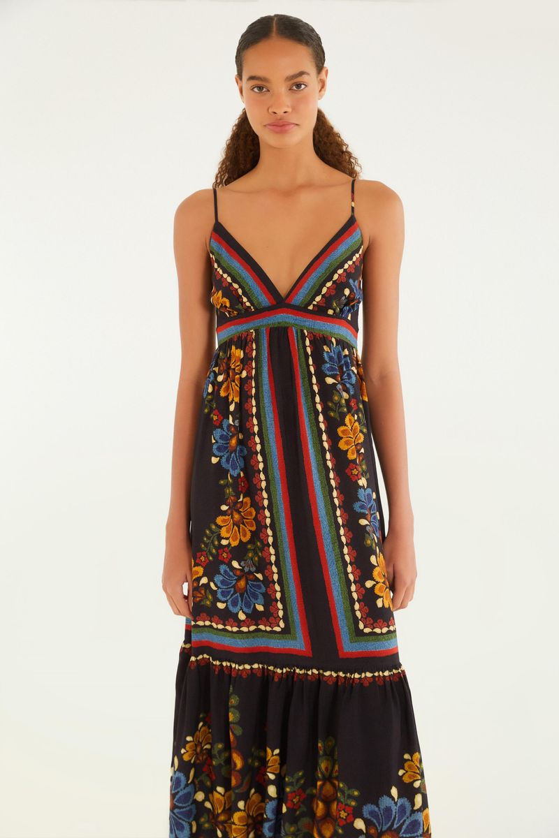 Vestido estampado con tirantes finos y escote en V, mostrado de espaldas.