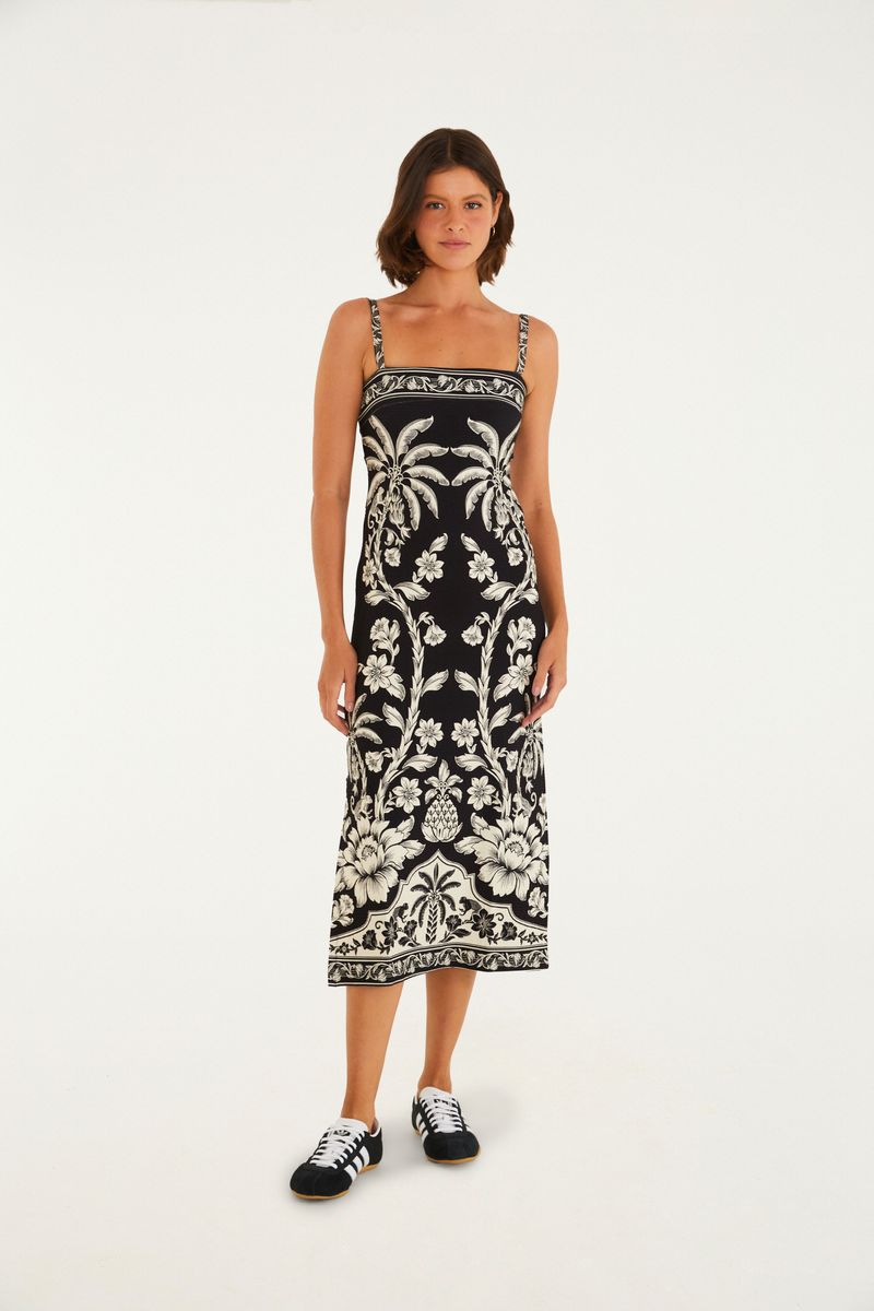 Vestido midi con estampado botánico en blanco y negro, tirantes finos y silueta ajustada, visto desde el frente.