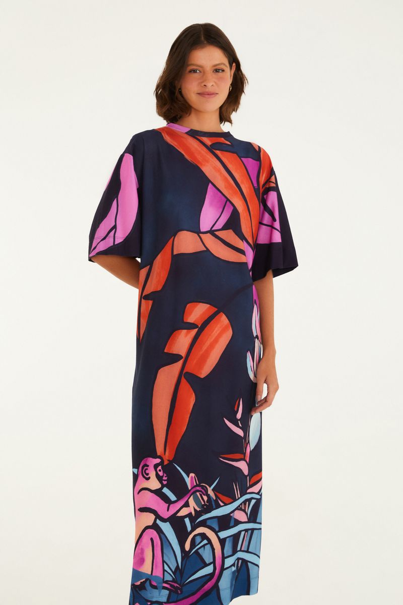 Vestido midi con estampado vibrante de bananas y flora, visto de lado.