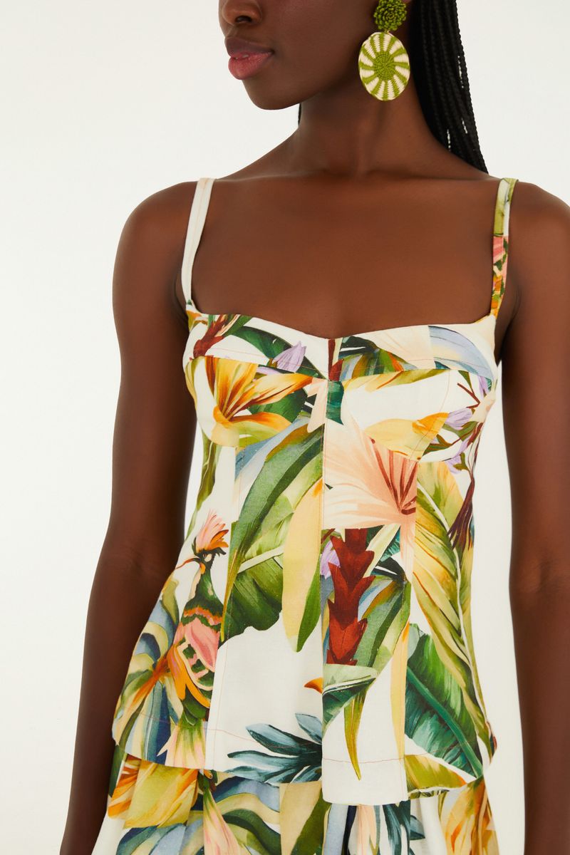 Detalle del estampado tropical de la Blusa Tropicalia con elementos florales y follaje.