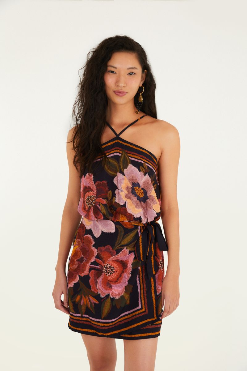 Vestido corto floral Cleo visto de frente, con tirantes finos y estampado floral vibrante.