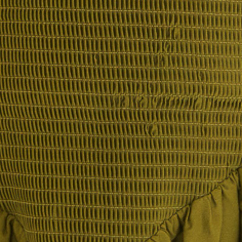 Detalle del corsé con lastex de un vestido largo verde.