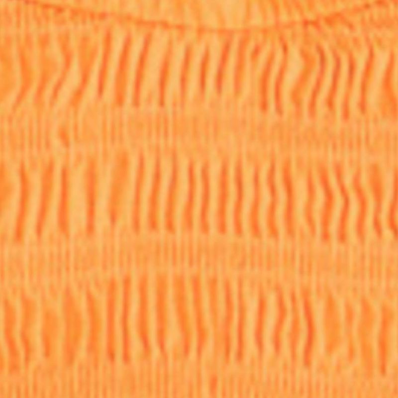 Detalle del tejido lastex de la blusa estilo peplum.