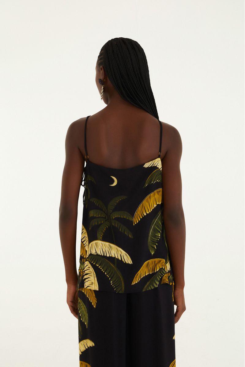 Vista trasera de la Blusa Itacare Negro con estampado tropical.
