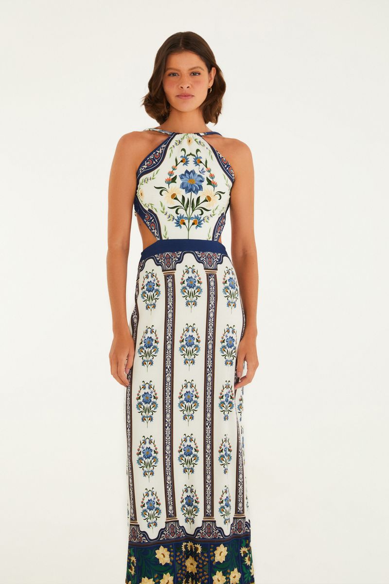 Vestido midi con estampado floral en fondo claro, vista trasera.