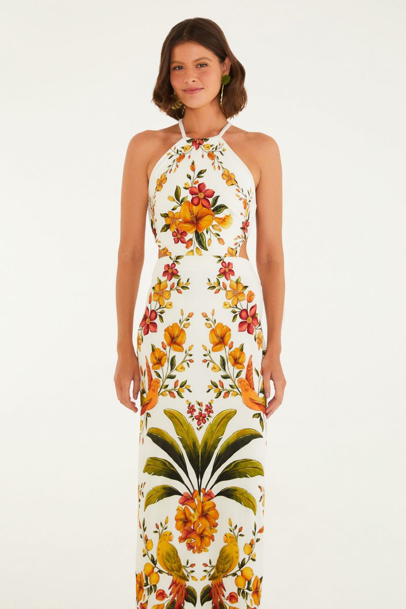 Vestido midi con estampado floral vibrante, tirantes finos y escote halter, visto desde atrás.