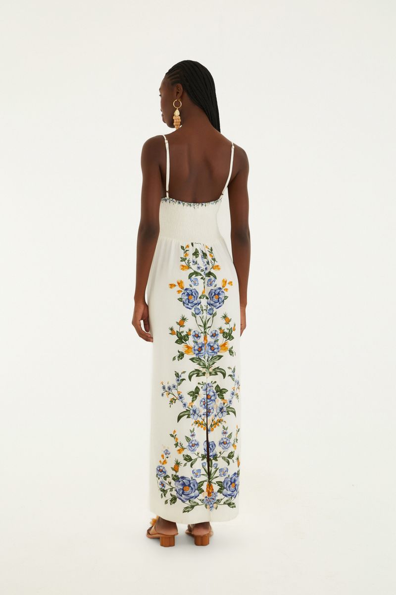 Vista lateral del vestido midi sin tiras con estampado floral y de piña.
