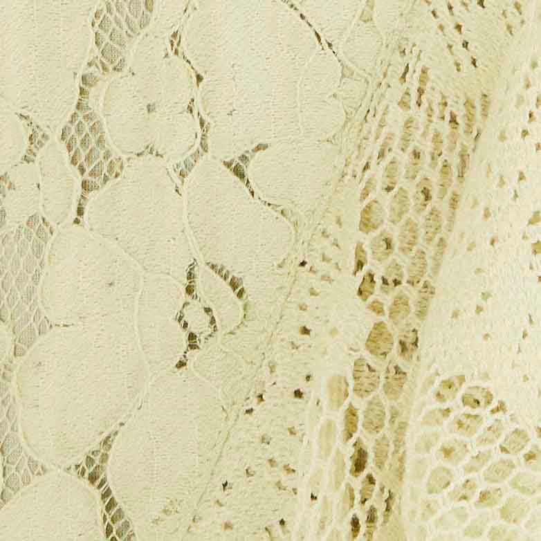 Rear view of the Patch Lace Dress showing fine spaghetti straps, low back, and ruffled hem